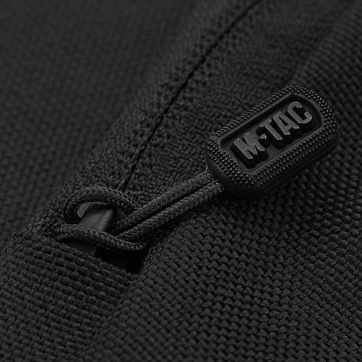 M-Tac Carry Sling Taske Elite Gen.IV, musta tiheästi kudottu nylon, Velcro ja kumilogo vetoketjussa, galleria, positio 1