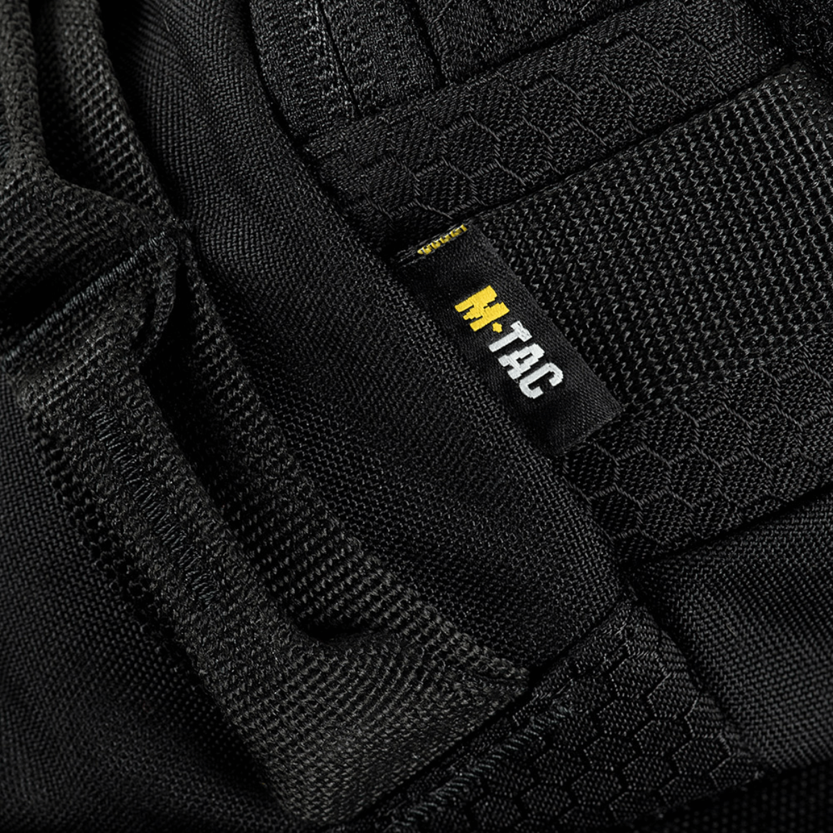 Lähikuva M‑Tac Bæltetaske Elite Hexistä Cordura-materiaalilla ja M‑Tac-logolla.