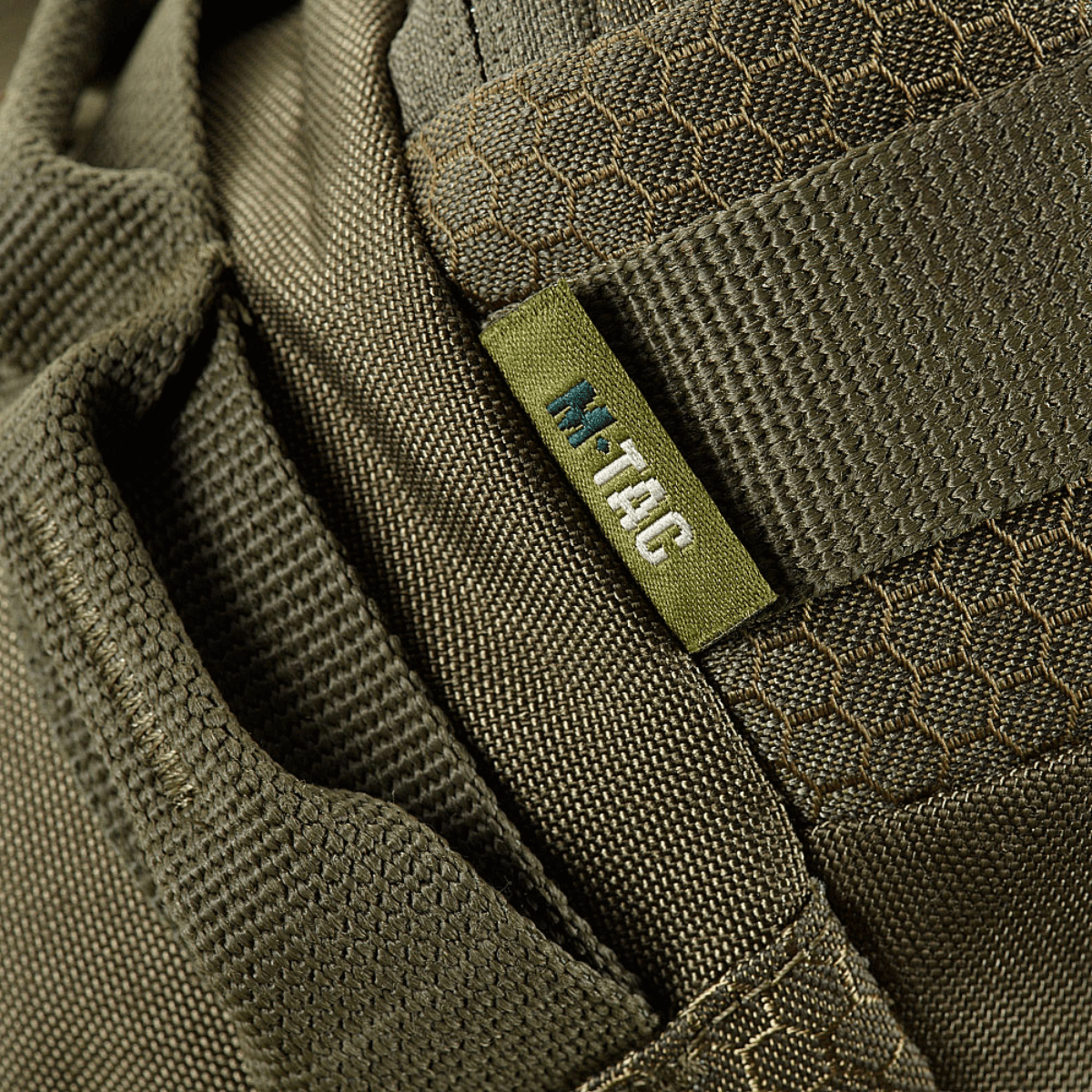 Lähikuva M‑Tac Bæltetaske Elite Hexistä kestävästä Cordura-materiaalista, tyylikäs ja ajaton ulkonäkö.