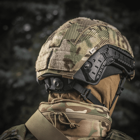 M‑Tac Hjelmcover Shroud Elite MULTICAM-camossa TOR-D-kypärille, tehty Cordura 500D:stä ja meshistä, Velcro-paneelit ja remmit.