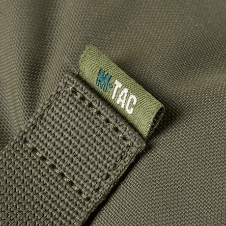 Yksityiskohta M-Tac Pouch Sukharka Gen.3 XL:stä, Cordura 500D ja M-Tac-logon ommel.