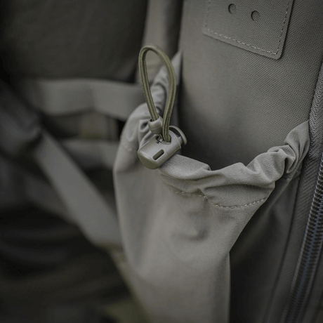 M-Tac STURM Elite -reppu joustavalla sivutaskulla ja kestävällä Cordura-rakenteella, ihanteellinen taktiseen käyttöön ja kenttävarusteille.