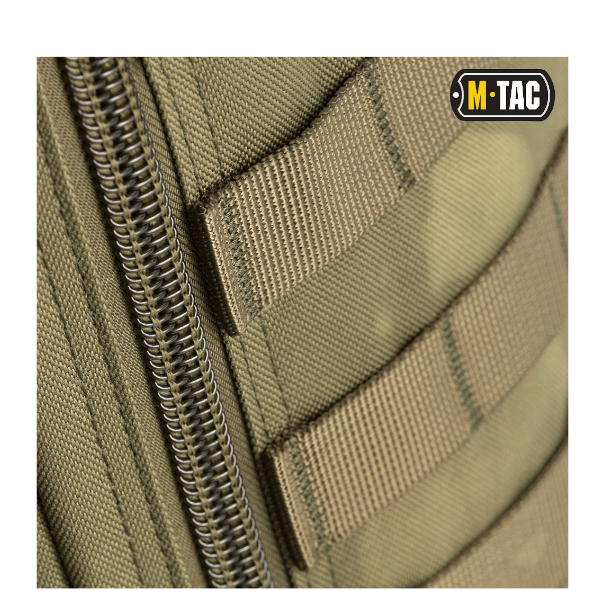 Lähikuva M-Tac Large Assault Pack -repusta, MOLLE-kiinnitys ja vetoketjudetaljit.
