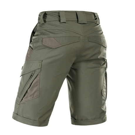 M-Tac Shorts Aggressor Gen.II Flex vihreänä, takaa kuvattuna, näyttää ripstop-materiaalin ja taktisen muotoilun taskuineen ja vyölenkkeineen.
