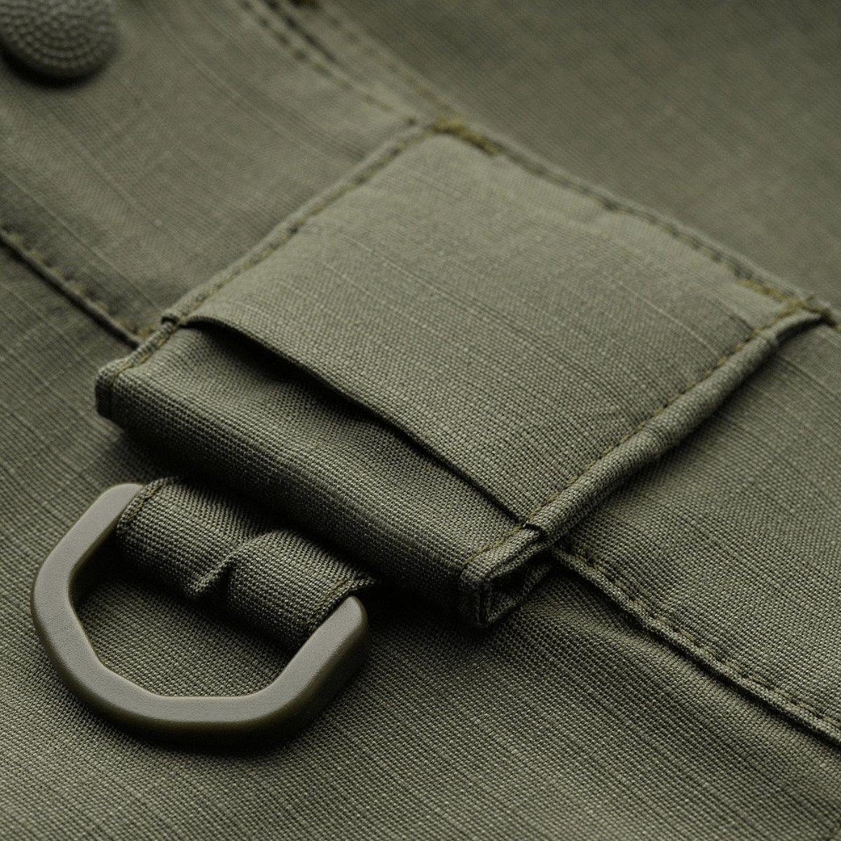 Lähikuva M-Tac Shorts Aggressor Gen.II Flexistä ripstop-materiaalilla ja Teflon-pinnoitteella, sopii harjoitteluun ja vapaa-aikaan, kulutusta kestävä muotoilu.