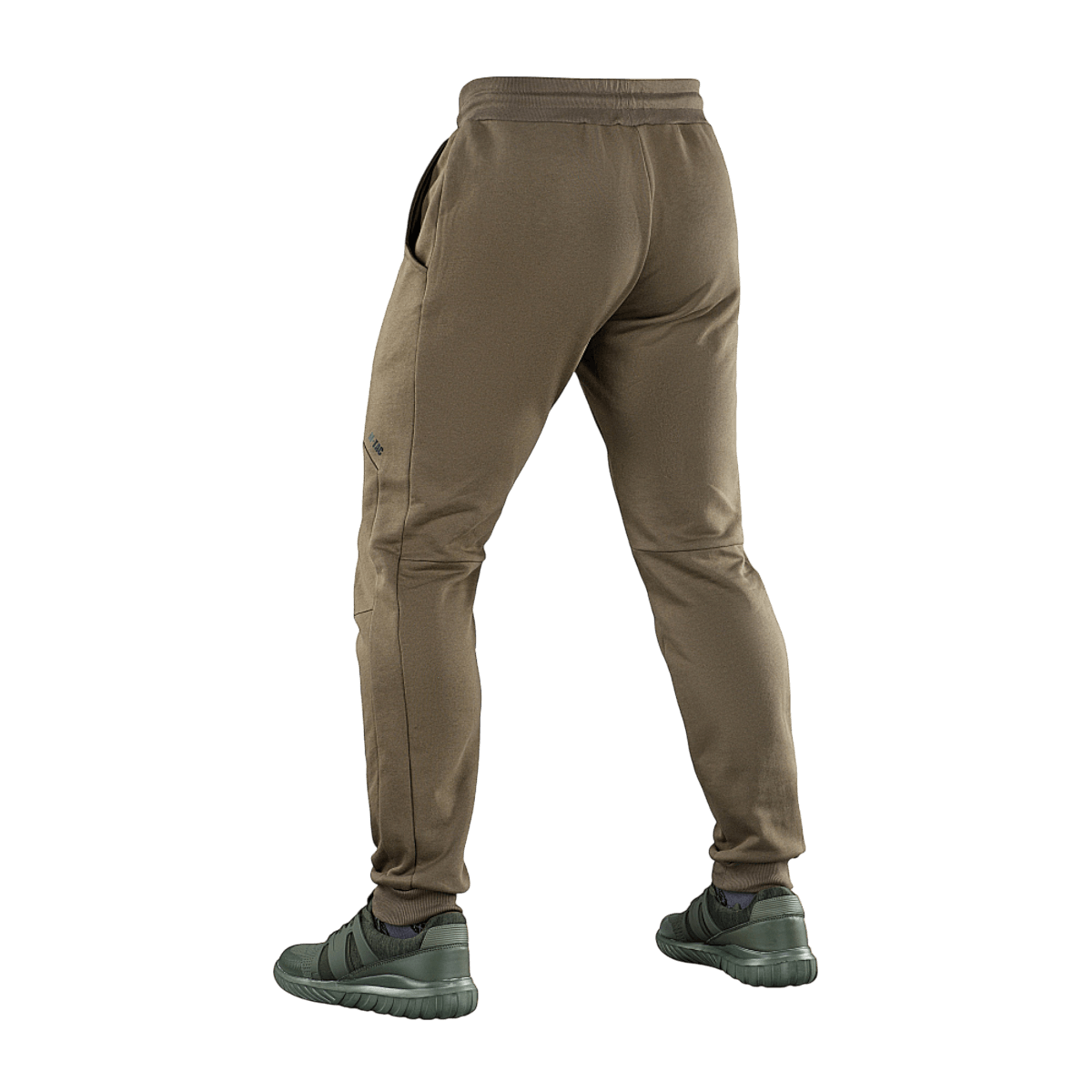 M-Tac Stealth Cotton -housut ruskeina, takaa nähtynä, kuminauha vyötäröllä ja sivutaskut, sporttinen tyyli liikkumisvapaudelle.