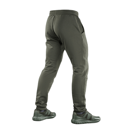 M-Tac Stealth Cotton -urheiluhousut puuvillaa kuminauhalla vyötäröllä, takaa nähtynä, täydelliset juoksuun ja kuntoiluun.