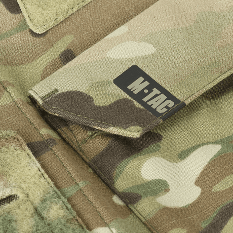 M-Tac Jakke Sturm NYCO Extreme Multicam, keskittyy kangasyksityiskohtiin ja kestävyyteen mukavassa sotilastakissa.
