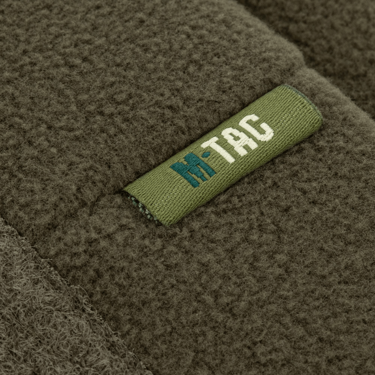 M-Tac Watch Cap Elite Fleece Beanie Hat Velcro, vihreä fleece Velcro-paneelilla merkeille, ihanteellinen kylmään säähän ja taktisiin aktiviteetteihin.