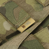 Yksityiskohta M-Tac War Belt ARMORista MOLLE-webbingillä, näyttää Cordura 500D:n maastokuvioinnissa.