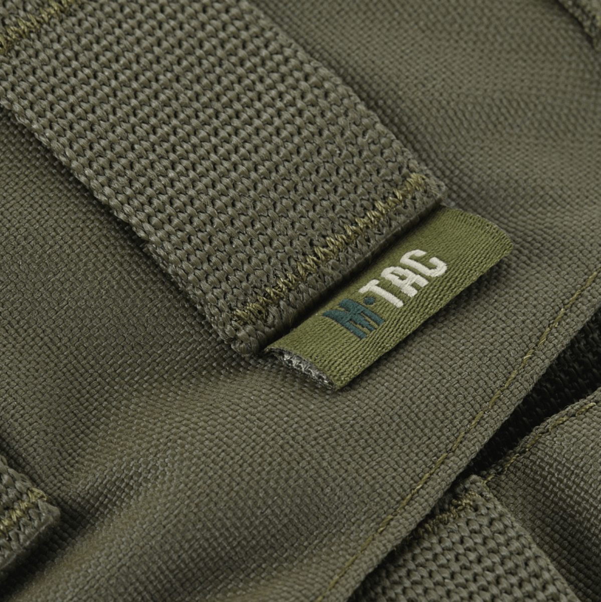 Lähikuva M-Tac War Belt ARMORista, valmistettu Cordura 500D:stä ja MIL-SPEC MOLLE-webbingillä taktisiin tarkoituksiin.