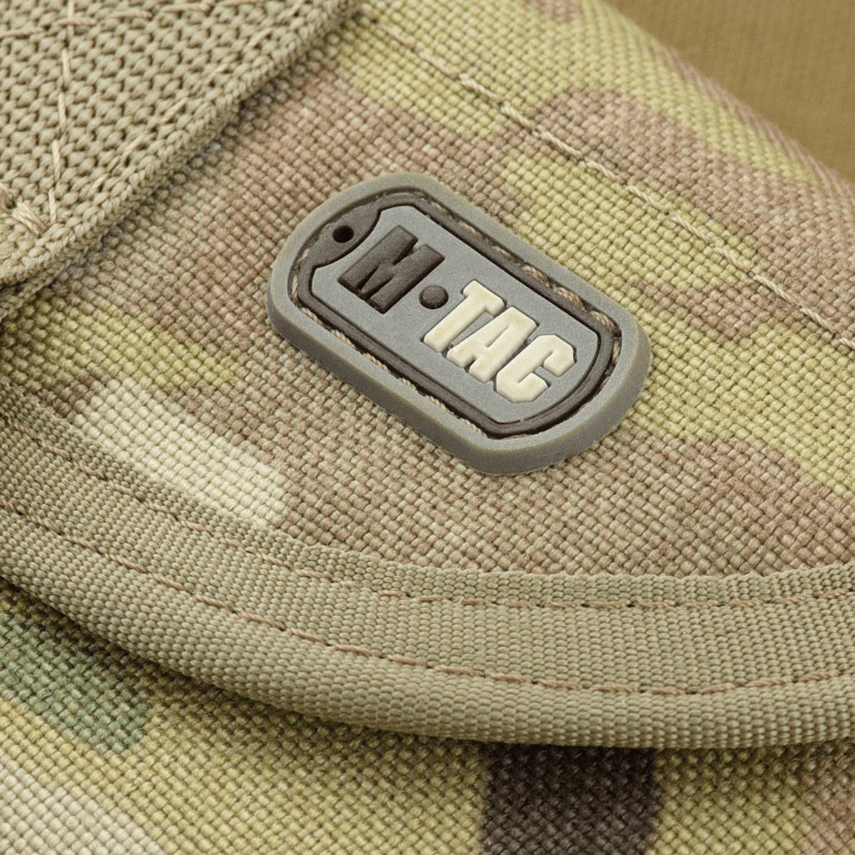 M-Tac taittolapion kotelo Multicam – kestävä taktinen CORDURA 1000D -materiaalista, tukeva MOLLE-kotelo yksityiskohdassa.