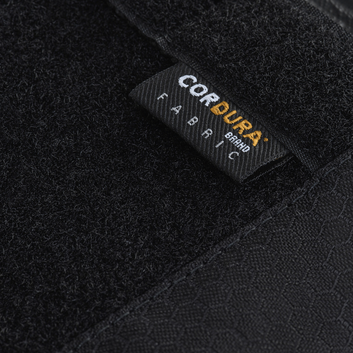 Lähikuva Cordura-kangasmerkistä M-Tac Tactical Weapon Case Backpack 125 cm Elite Hex GEN.II:ssä