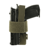 M-Tac modulaarinen universalinen Lås Light -pistoolikotelo taktiseen käyttöön ja piilotettuun kantoon, säädettävä Velcro-nauha pitää aseen paikoillaan.