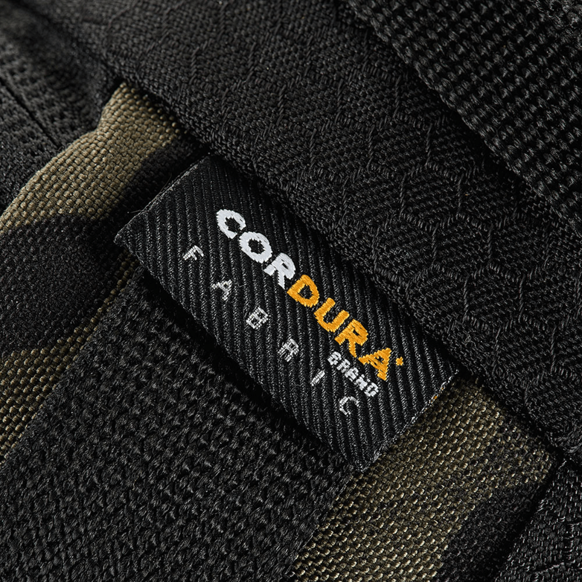 M‑Tac Elite Hex -vyölaukku Cordura-kankaassa, lähikuva yksityiskohdista ja merkinnästä.