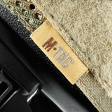 M-Tac Hjelmcover Shroud Elite Cordura 500D:stä MULTICAM-muotoilulla ja Velcro-paneeleilla TOR-D-kypärille. Suojaa kulumalta ja vaurioilta.