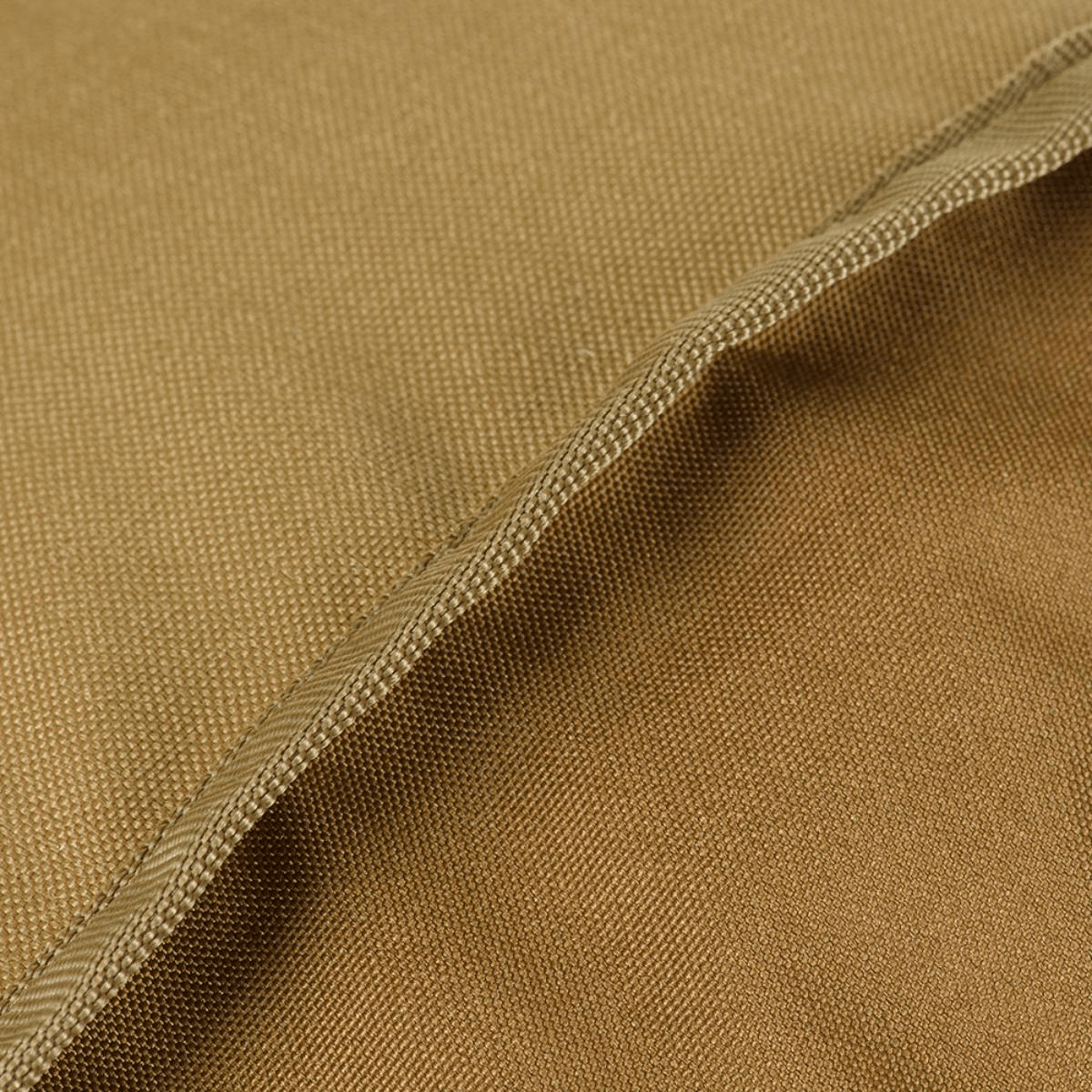 Materiaalin yksityiskohta M-Tac Pouch Sukharka Gen.3 XL:stä, Cordura 500D, kestävä ruskeasävy.