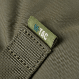 Yksityiskohta M-Tac Pouch Sukharka Gen.3 XL:stä, Cordura 500D ja M-Tac-logon ommel.