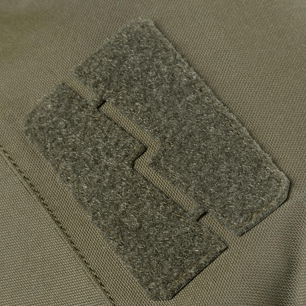 Yksityiskohta M-Tac Pouch Sukharka Gen.3 XL:stä Cordura 500D:llä ja velcro-tarralla.