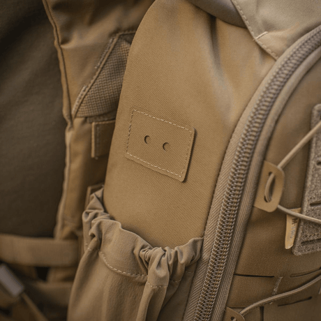 Lähikuva M-Tac STURM Elite -repusta, Cordura-materiaali, joustavat sivutaskut ja YKK-komponentit.