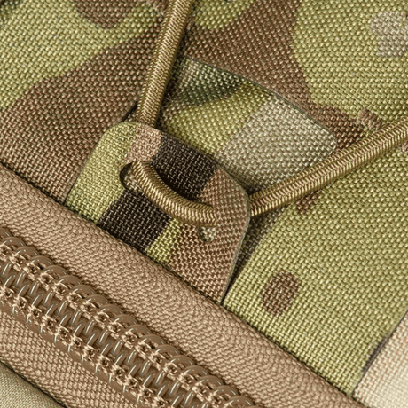 Lähikuva M-Tac STURM Elite -repusta camo-kuvio, Cordura-materiaali ja YKK-vetoketju.