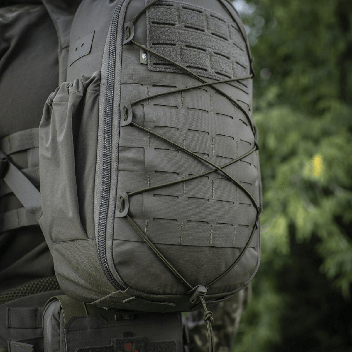 M-Tac STURM Elite -reppu MOLLE Laser Cut -etupaneelilla, joustavat sivutaskut ja vahva Cordura-materiaali.