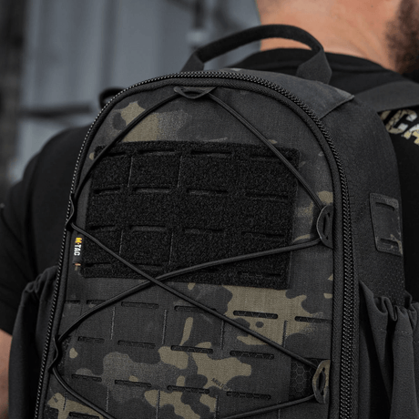 M-Tac STURM Elite -reppu mustassa maastokuviossa, MOLLE Laser Cut -paneelilla, ihanteellinen taktiseen käyttöön ja lyhyille kenttäretkille, valmistettu Cordurasta.