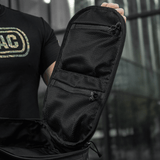 Avoin M-Tac STURM Elite -reppu vetoketjutaskuilla, musta taktinen reppu ulkokäyttöön.