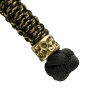 M-Tac Knife Lanyard Scandinavian Granule punottu paracord kultaisilla yksityiskohdilla ja mustalla solmulla, tyylikäs lisävaruste taskuveitsille.