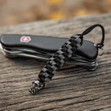 M-Tac Knife Lanyard Helix Skull punottu paracord taskuveitsille tyylikkäällä kallodesignilla, joustava kahvan jatke.