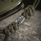 M-Tac Zeus Stainless Steel Lanyard, punottu paracord ja koristeellinen metallhelmi veitsessä, täydellinen nopeaan käyttöön.