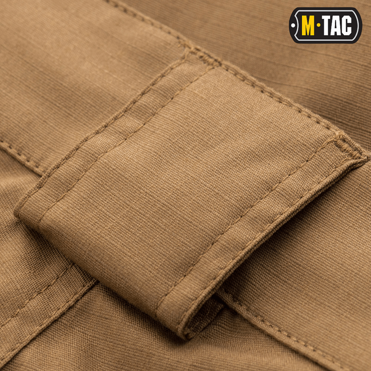 M-Tac Shorts Aggressor Short yksityiskohtaisella kuvalla vyölenkistä polycotton Flex rip-stop -materiaalissa. Ihanteellinen taktiseen käyttöön.