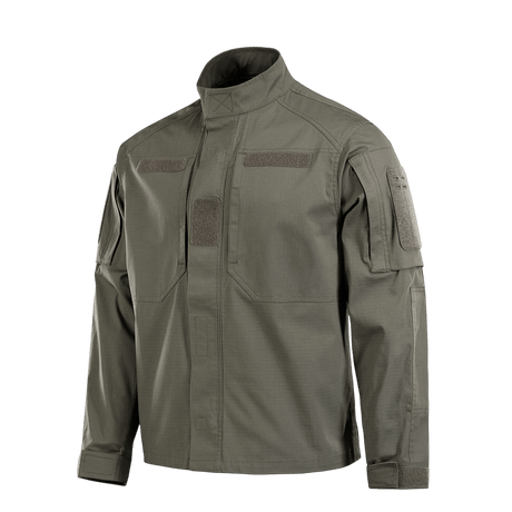 M-Tac Patrol Flex -takki oliivinvihreänä, Velcro-taskuilla ja YKK-fittingseillä taktiseen käyttöön.