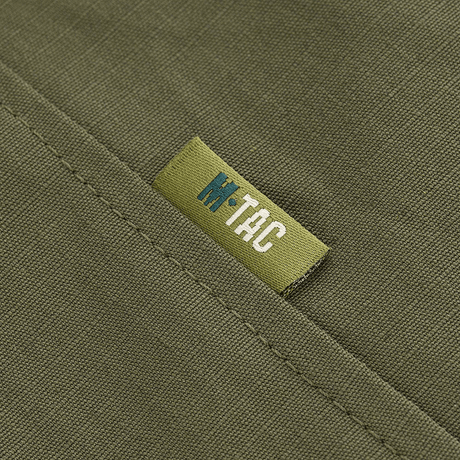 Yksityiskohta M-Tac Patrol Flex -takista merkillä vihreässä sävyssä.