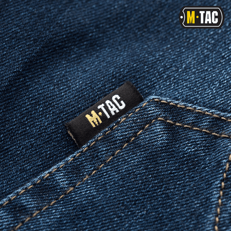 Lähikuva M-Tac Tactical Gen.I Regular Fit -farkuista M-Tac-logolla