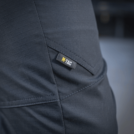 M-Tac Tactical Bukser Patrol Gen II Flex lähikuva, M-Tac-logo taskussa.