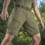 M-Tac Shorts Rubicon Flex tummanoliivinvihreät, suunniteltu cargotaskuilla ja 4-suuntainen jousto mukavuutta ja toiminnallisuutta varten kesällä.