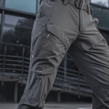 M-Tac Rubicon Flex -housut harmaana, ergonominen muotoilu ja innovatiivinen cargo-tasku, ihanteelliset harjoitteluun, työhön ja vapaa-aikaan.