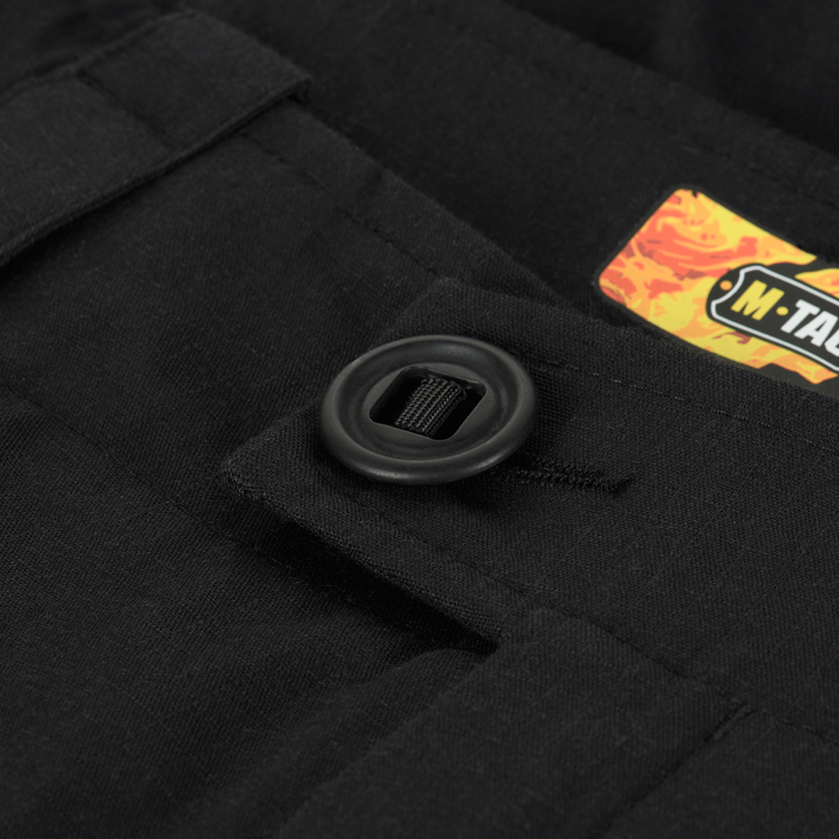 Napin yksityiskohta M-Tac STURM NyCo Extreme Gen.II -housuista, suunniteltu kestäväksi.