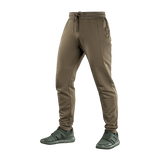 M-Tac Stealth Cotton -housut ruskeana, puuvillahousut kuminauhalla vyötäröllä ja sivutaskuilla, ihanteelliset juoksuun ja treeniin.