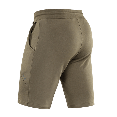 M-Tac Shorts Casual Fit Cotton oliivinvihreänä sivutaskuilla ja kuminauhavyötäröllä, nähtynä takaa. Valmistettu pehmeästä 100 % puuvillasta.