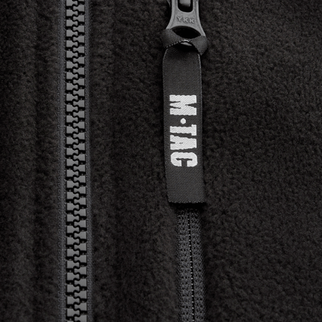 Vetoketjun yksityiskohta M-Tac Alpha Microfleece Jakke Gen.II -takissa vahvistetuilla materiaaleilla taktista käyttöä ja ulkoiluseikkailuja varten.