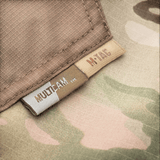 M-Tac housut Aggressor Elite NYCO multicam, ripstop-kangas ja yksityiskohtainen ommel, lähikuva merkeistä ja materiaalista, galleria-asento 1.