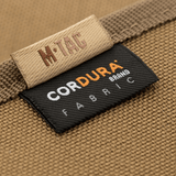 M-Tac Patch Panel Elite Large valmistettu kestävästä 1000D CORDURA® -materiaalista, yksityiskohta merkkilapusta.