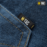 M-Tac Jeans Tactical Gen. I Cordura Regular Fit – lähikuva vahvasta denimmateriaalista, M-Tac-etiketti ja vahvistetut saumat.