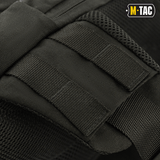 Yksityiskohtia M-Tac Buckler Taske Elite -laukusta MOLLE-järjestelmällä lisävarusteille ja kestävällä Cordura 500D -materiaalilla.