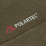 M-Tac Combat Fleece Polartec -takki Polartec®-materiaalilla oliivinvihreänä, tekstuuri ja merkin logo näkyvissä.