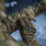 M-Tac Alpha Gen.IV Pro Primaloft -talvitakki Multicam-designissa, näyttää kestävän pinnan ja takin hihan yksityiskohdan.