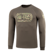 M-Tac Raglan Logo -paita, camokuvio ja 'Born by Revolution – Hardened by War' -iskulause hihassa. 95 % puuvillaa, 5 % elastaania