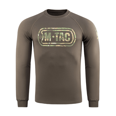 M-Tac Raglan Logo camokuvioidulla logolla, puuvillasekoite mukavuutta ja liikkuvuutta varten. Täydellinen taktiseen käyttöön